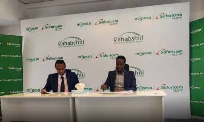 Dahabshiil country representative in Ethiopia Musse Mohamed (left) and MPESA Safaricom Acting Chief Digital Financial Services Anthony Kangethe during the signing of the partnership in Addis Ababa
